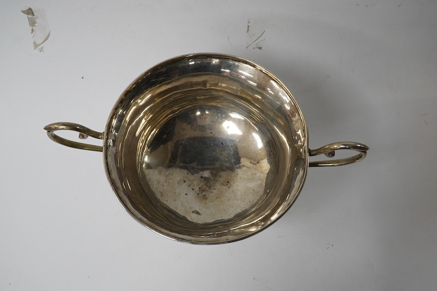 A white metal two handled pedestal trophy cup, stamped 'Barton silver', engraved with the letter S, height 16.3cm, 12.3oz. Condition - poor